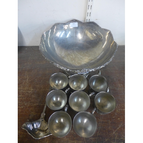 346 - A plated punch bowl, with eight cups and a ladle