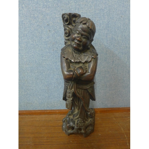 348 - An oriental carved hardwood figure of a sage