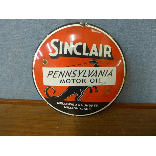 353 - An enamelled metal Sinclair Pennsylvania Motor Oil circular advertising sign