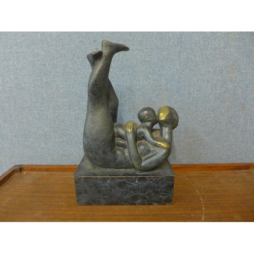 362 - A bronze abstract figure of a mother and child