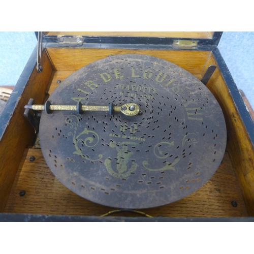 369 - A 19th Century Swiss walnut cased Polyphon music box, with additional discs