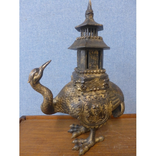 375 - An oriental gilt bronze mythical bird censor and cover