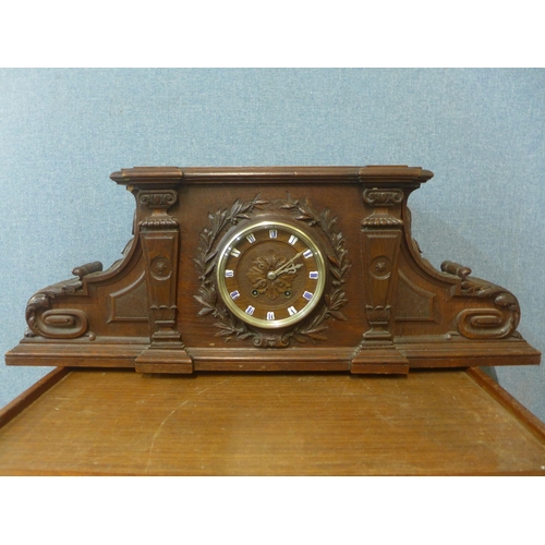 378 - A 19th Century French carved architectural cased oak mantel clock