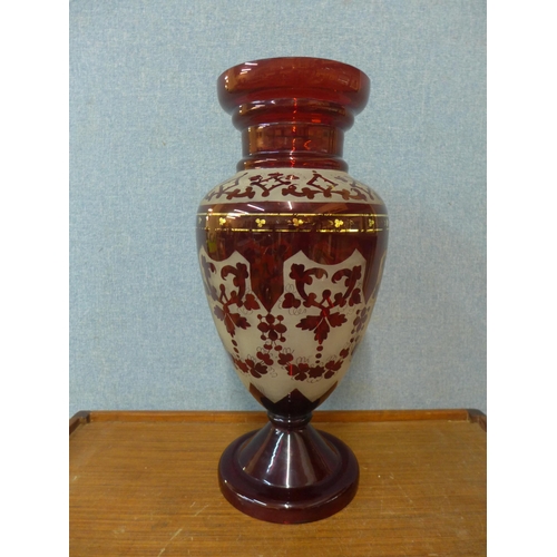 380 - A large etched cranberry glass vase