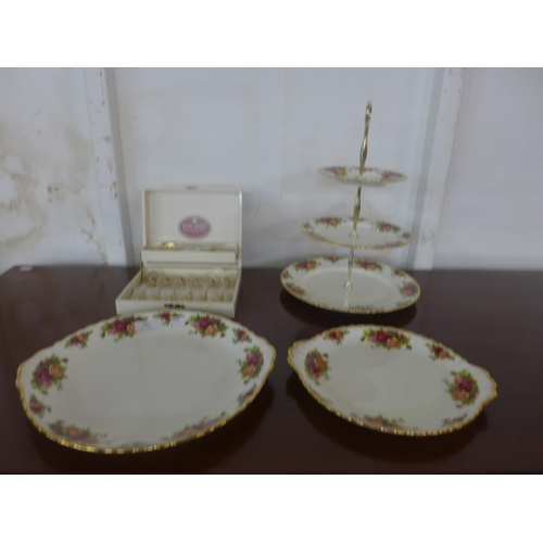 391 - A Royal Albert Old Country Roses cake stand, cake plates and a cased set of spoons