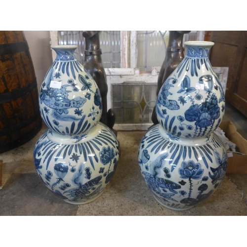 393 - A pair of Chinese blue and white porcelain double gourd shaped vases