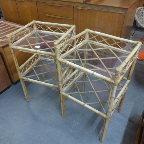 52 - A pair of glass topped two tier bamboo plant stands