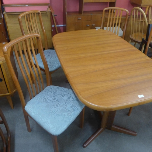 56 - A Danish Ansagar Mobler teak extending dining table and four chairs