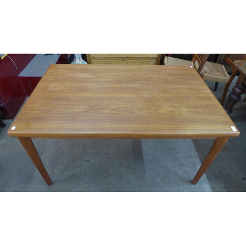 7 - A Danish teak extending dining table