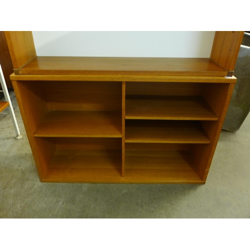 71 - Two teak coffee tables and two teak bookshelves