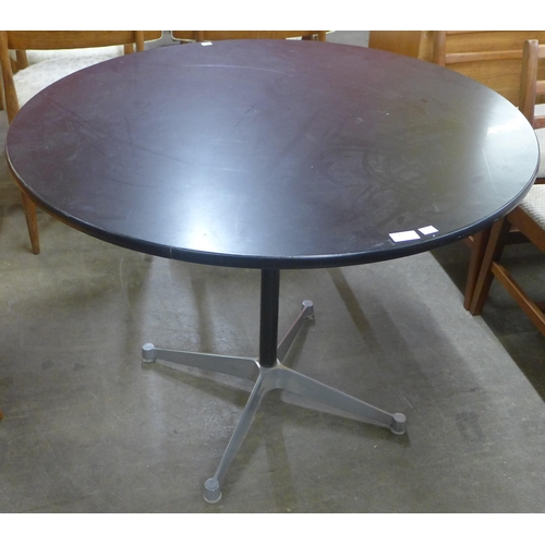 75 - An Eames style aluminium and black lacquered circular dining table