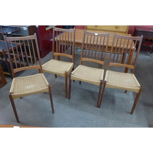 8 - A set of four Danish Mogens Kold teak and paper cord seated chairs, designed by Arne Hovmand Olsen