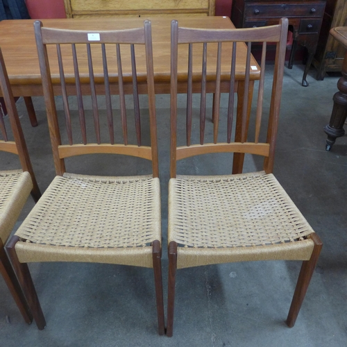 8 - A set of four Danish Mogens Kold teak and paper cord seated chairs, designed by Arne Hovmand Olsen