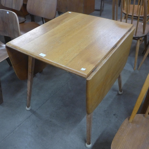 87 - An Ercol Blonde and beech Windsor drop-leaf table