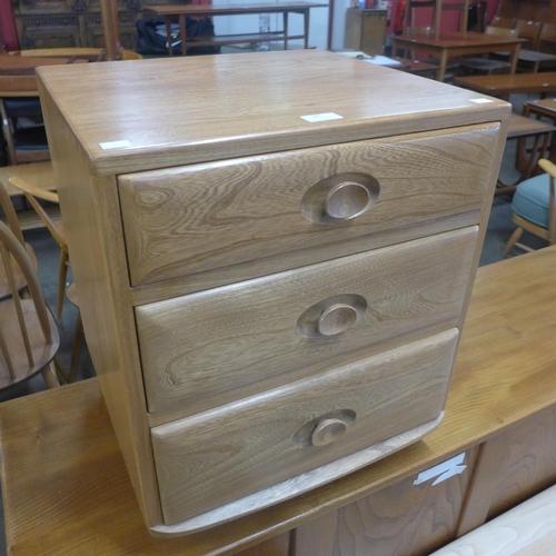 89 - An Ercol Blonde ash bedside chest