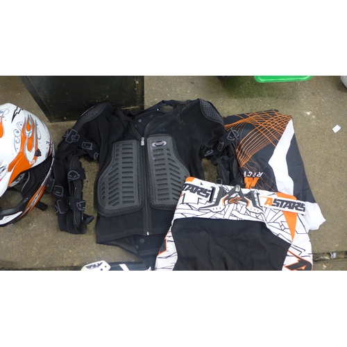 2376 - A quantity of motorcycle clothing:- a full suit of armor, two helmets (Syco, HGC), a HGC full body s... 