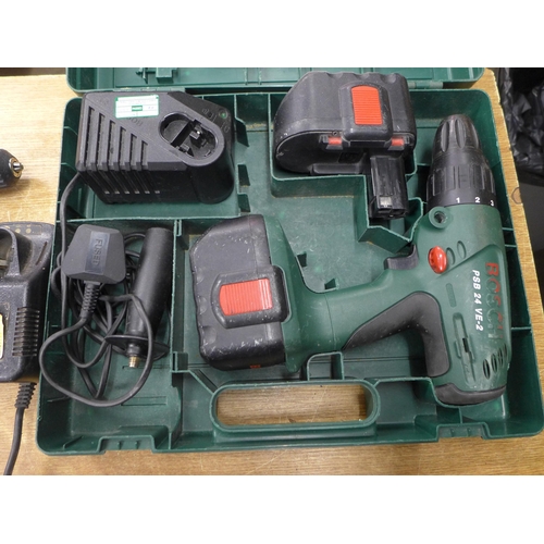 2050 - A Bosch PSB 24 VE-2 hammer drill with two batteries and charger in case, with a Tesco drill