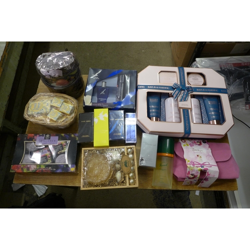 2107 - A box of assorted cosmetics and perfume sets