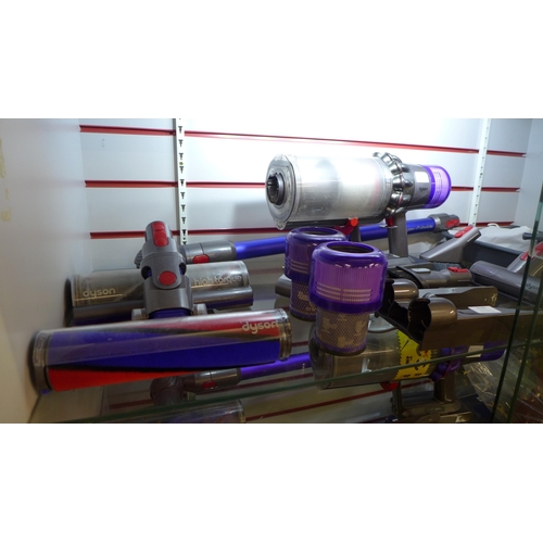 2126 - A Dyson V11 Absolute vacuum cleaner with charger, dock, replacement filters, and all attachments