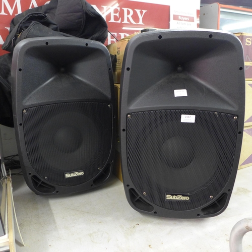 2157 - Two SubZero speakers with covers (SZPA-P12)