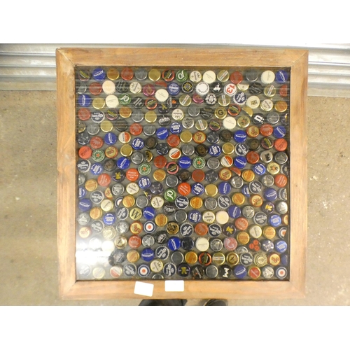 2342 - A beer bottle top inlaid garden table