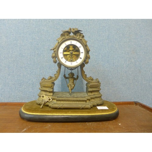 368A - A 19th Century French gilt spelter mantel clock  with girl on a swing