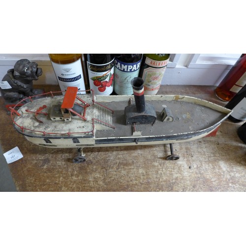 787 - A Victorian pressed steel clockwork paddle steamer pond yacht, incomplete, 50cm