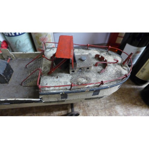 787 - A Victorian pressed steel clockwork paddle steamer pond yacht, incomplete, 50cm