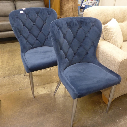 1368 - A pair of blue velvet upholstered buttoned back dining chairs * this lot is subject to VAT