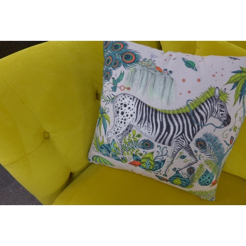 1349 - A mustard velvet upholstered three seater sofa with buttoned arms and zebra scatter cushions - small... 