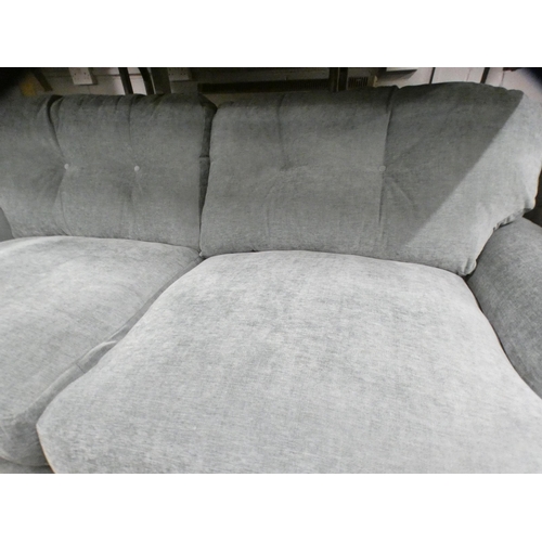 1398 - A teal upholstered three seater sofa on turned legs RRP £949