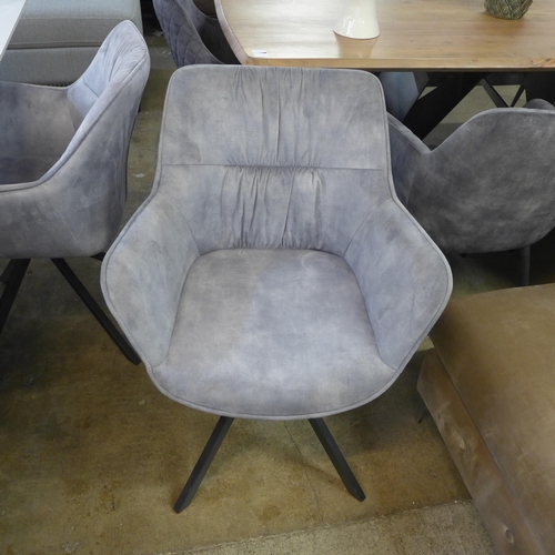 1433 - A Kos 130cm - 180cm extending dining table and a Harlequin set of six grey velvet dining chairs * Th... 
