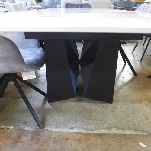 1433 - A Kos 130cm - 180cm extending dining table and a Harlequin set of six grey velvet dining chairs * Th... 