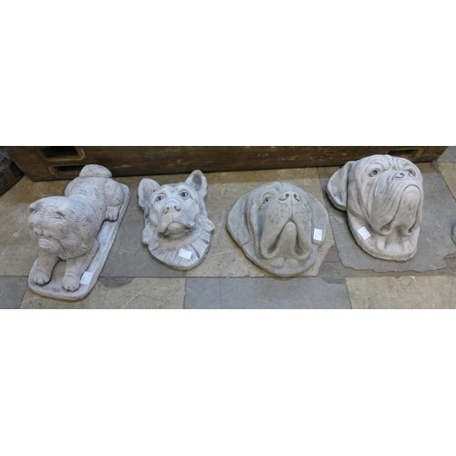 300 - Three concrete dogs and a figure