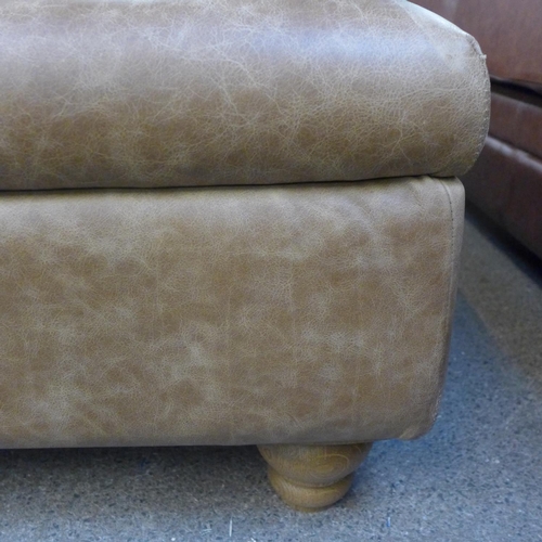 1302 - A tan vintage leather large footstool * this lot is subject to VAT