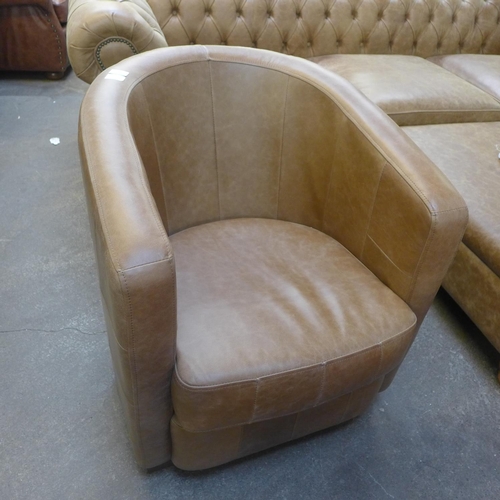 1303 - A vintage tan vintage leather club chair, RRP £860 * this lot is subject to VAT