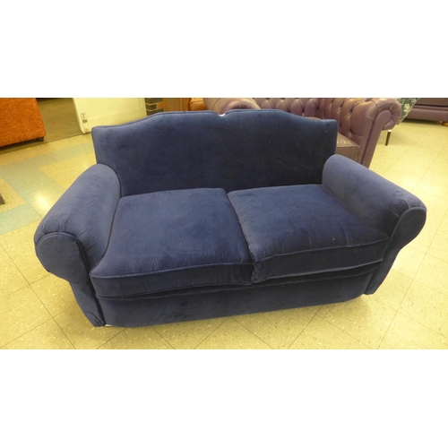 1307 - An Old Lace deep blue velvet upholstered two seater sofa, RRP £1900 * this lot is subject to VAT