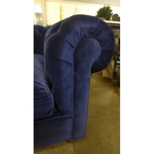 1327 - An Alfie navy blue upholstered Chesterfield style four seater sofa bed, RRP £3190 * this lot is subj... 