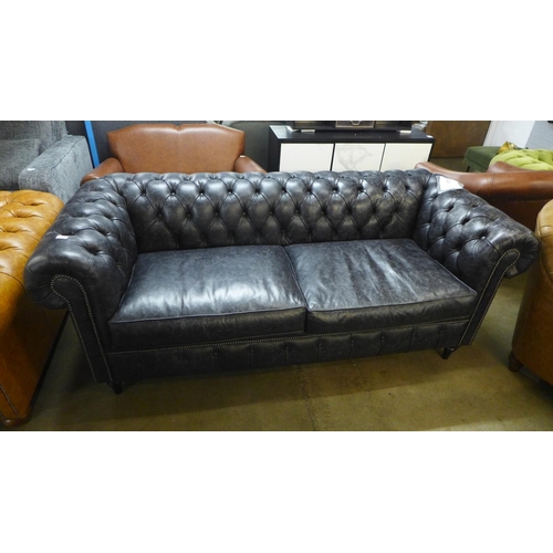 1387 - A 'Historian' Hobnail liquorice distressed leather upholstered Chesterfield style three seater sofa ... 