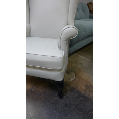 1399 - A John Lewis/Parker Knoll leather wingback chair and footstool, light grey