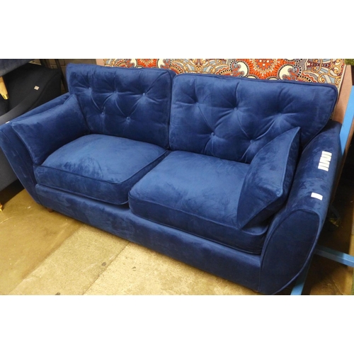 1413 - A blue velvet Hoxton three seater sofa - RRP £799