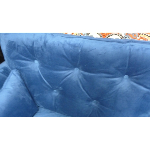 1414 - A blue velvet Hoxton three seater sofa - RRP £799