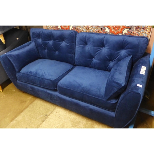 1415 - A blue velvet Hoxton three seater sofa - RRP £799