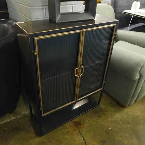 1439 - An industrial style metal wall cabinet wtih reeded glass