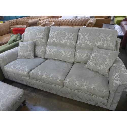 1468 - A Duresta large three seater sofa and footstool in patterned fabric