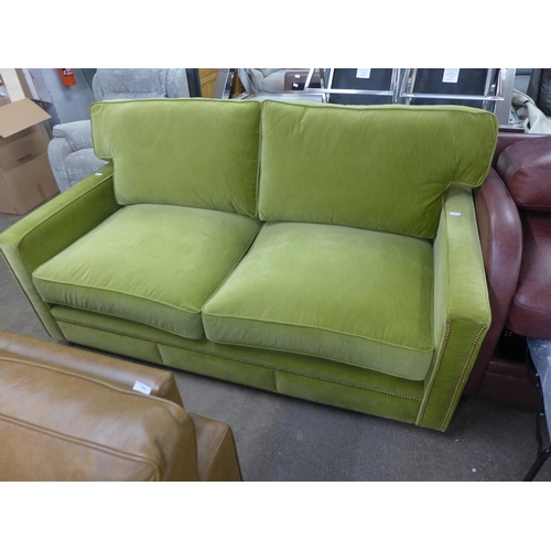 1489 - A willow velvet leather two and a half seater sofa with studwork , RRP £2380 * this lot is subject t... 