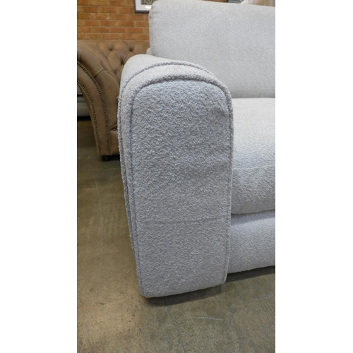 1494 - An ivory upholstered three seater sofa RRP £1099