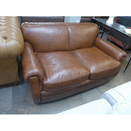 1496 - A Parisian dark tan leather two seater sofa with stud work , RRP £2155 * this lot is subject to VAT