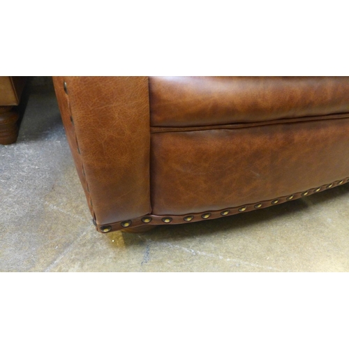 1496 - A Parisian dark tan leather two seater sofa with stud work , RRP £2155 * this lot is subject to VAT