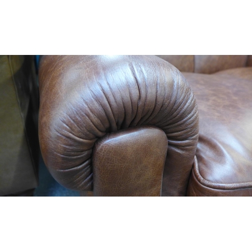 1496 - A Parisian dark tan leather two seater sofa with stud work , RRP £2155 * this lot is subject to VAT